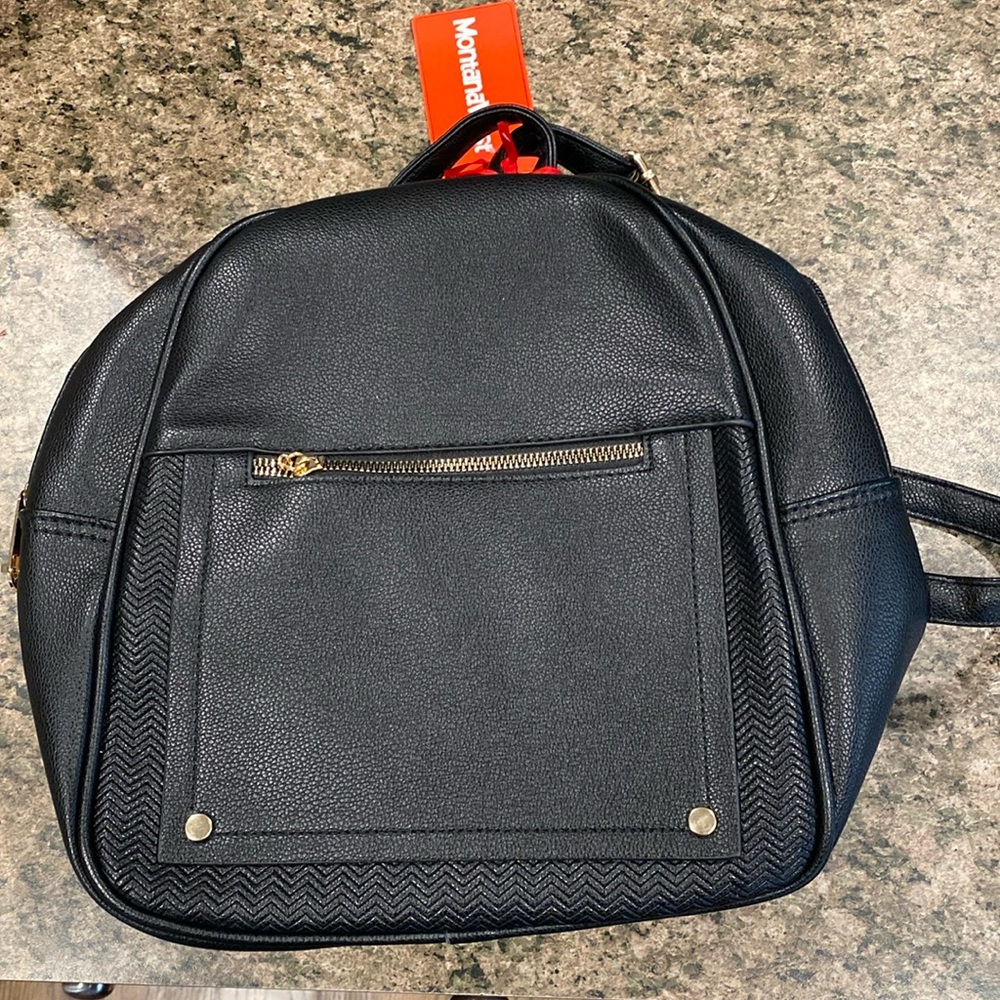 Black leather backpack. Never used, perfect condition.